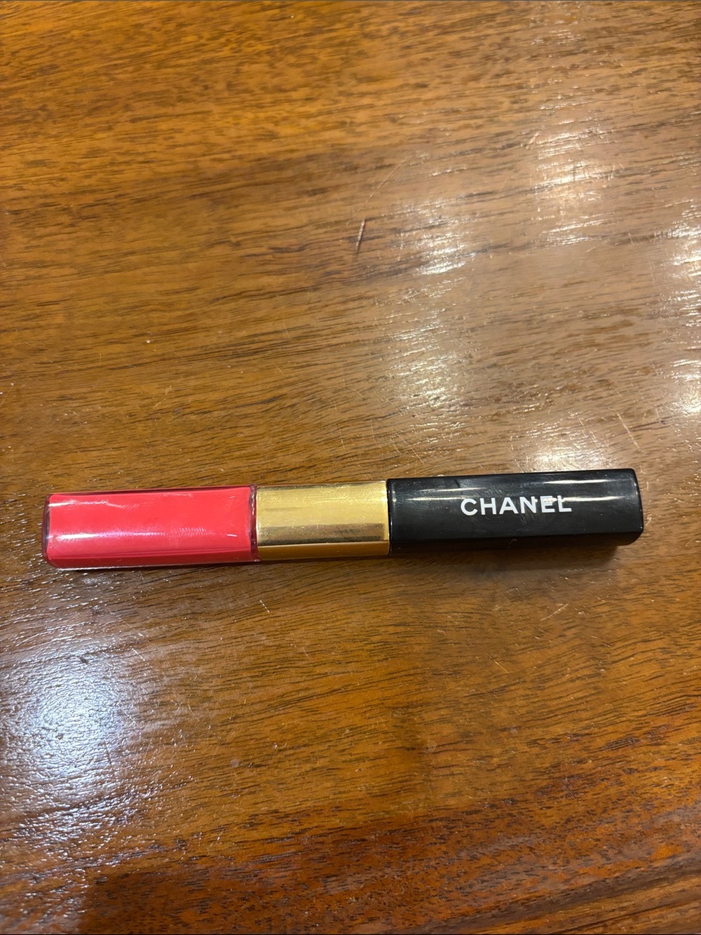 CHANEL Le Rouge Duo Color - Bright Radiant Pink with Gold & Black Accents.